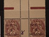 deux timbres avec la photo d'un homme et d'une femme