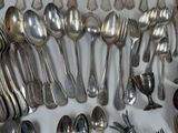a lot of spoons and spoon spoons on the table