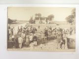 an old photo of a group of people riding horses