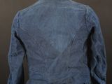 the back of a denim jacket on a mannequin mannequin
