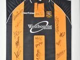 framed picture of a football shirt with signed autographs on it