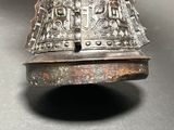 a close up of a metal bell on a table