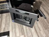 a coffee machine sitting on the floor in a living room