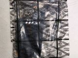 a black and white picture of a bag with a cell phone inside of it