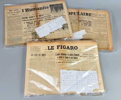 three newspapers are wrapped in plastic and sitting on top of a table