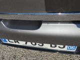 a close up of a car ' s bumper with a license plate on it