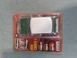 a toy car that is in a package on a table