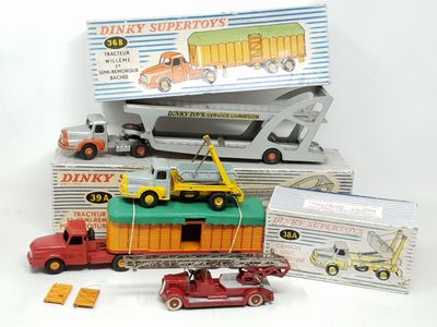 many toy trucks and trucks that are sitting on top of each other