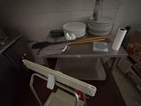 an image of a kitchen with a chair in it