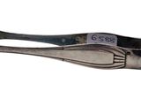a silver spoon with a silver handle on a white background