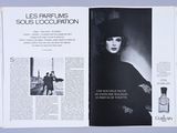 an open magazine with a picture of a woman in a hat and a man in a top hat