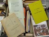 a pile of books sitting on top of a table