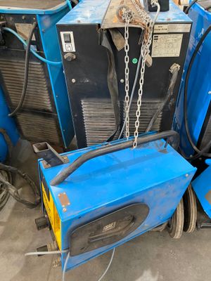 a blue machine that is sitting in the garage