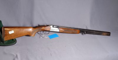 a shotgun that is sitting on top of a table
