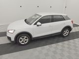 the white audi suv is parked in a clean garage