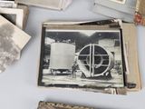 many old photos of a man standing in front of a machine