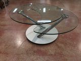 a glass table with a metal base and a glass top