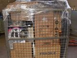 a cart with a bunch of boxes on it in a warehouse