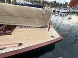 a sail boat that is docked in the water