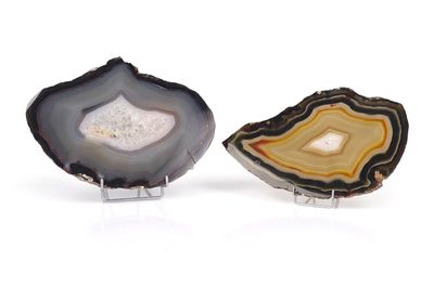two pieces of agate on a white surface with a white background