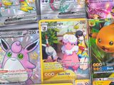 a lot of pokemon cards that are on the table