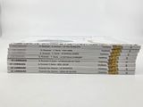 six books stacked on top of each other on a white surface