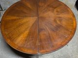 an image of a round table with a wooden top and metal legs