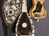 three different types of musical instruments are displayed on a purple surface
