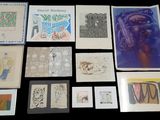 many different types of art on display on the table
