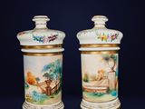 pair of antique porcelain vases with hand painted scenes on them