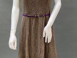 an image of a mannequin wearing a brown dress with a purple belt