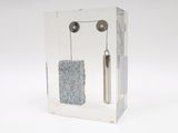 a clear box with a pair of earphones in it
