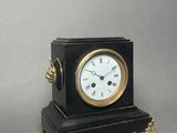 a small clock that is sitting on a table