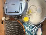a box full of items that are sitting on the ground