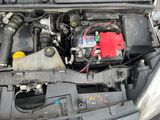 a car engine with a red battery in it