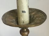 a candle that is sitting on a plate on a table