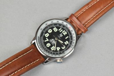 an image of a close up of a wrist watch on a table