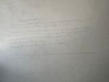 a piece of paper with writing on it on the wall
