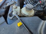 a close up of a car ' s engine with the hood open