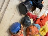 a lot of dolls that are laying on the floor
