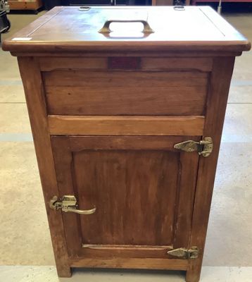 an old wooden cabinet with a sink on top of it