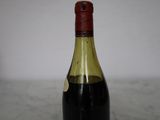 a bottle of wine that is sitting on a table