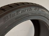 a close up of a tire on a white surface