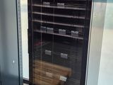 a refrigerator that is sitting in the corner of a room