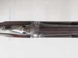 a close up of a gun on display in a glass case