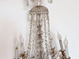 a chandelier hanging from the ceiling in a room