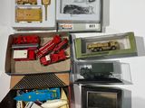 a box of assorted toy cars and other items