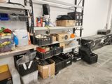 many boxes and containers on the shelves in the garage