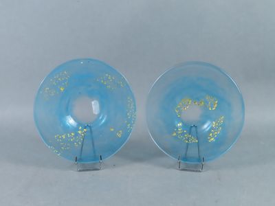 pair of blue glass plates with gold leaf designs on them