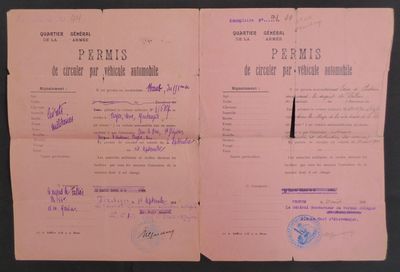 an old document with purple writing on it sitting on top of a table
